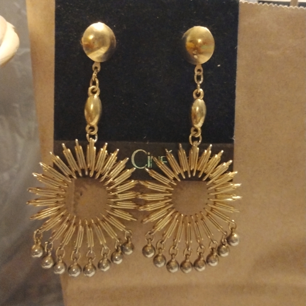 Unique and fun hanging surgical steel post earrings. NWT